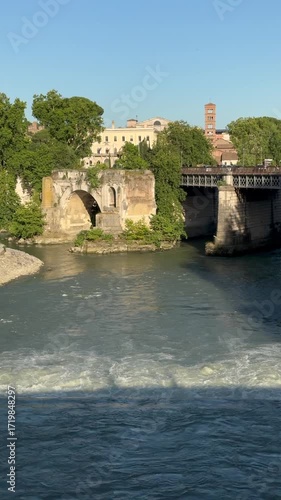 view of the Tiber River near Tiber Island in central Rome.