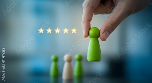 Hand Selecting Green Pawn Figure with Five Star Rating