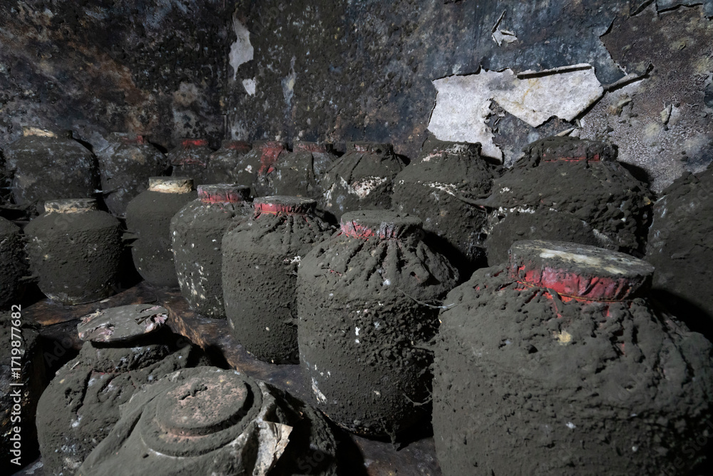 Fototapeta premium Aged sorghum wine stored in the basement cellar
