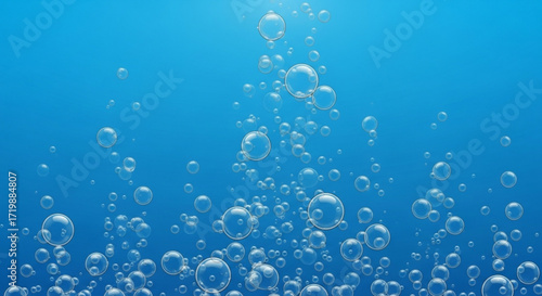 Bubbles ascend gracefully through the deep blue, creating a mesmerizing underwater spectacle of light, movement, and ethereal beauty