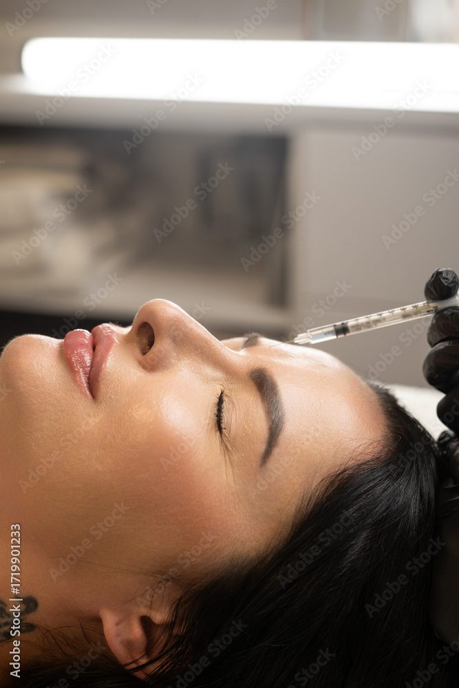 custom made wallpaper toronto digitalClose-up of a woman receiving a cosmetic forehead injection. A professional in black gloves performs a beauty treatment procedure with a syringe, highlighting modern aesthetics, skincare, and anti