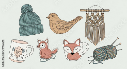 Cozy winter and autumn themed illustration featuring a beanie, bird, macrame, mug, fox, and yarn ball with knitting needles, perfect for seasonal designs
