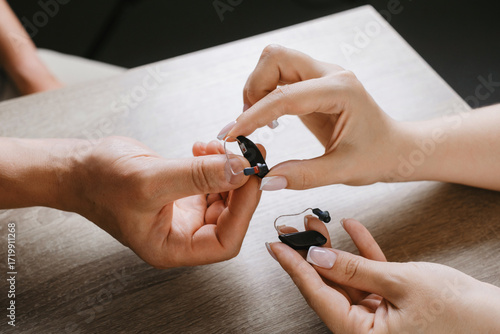 Billede på lærred Modern miniature hearing aids