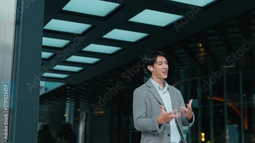 Wallpaper Mural Successful young businessman smiling and enjoying,Dancing a moment of relaxation after work.A cheerful entrepreneur listening to music and Dance on the street,feeling confident and Relex. Torontodigital.ca