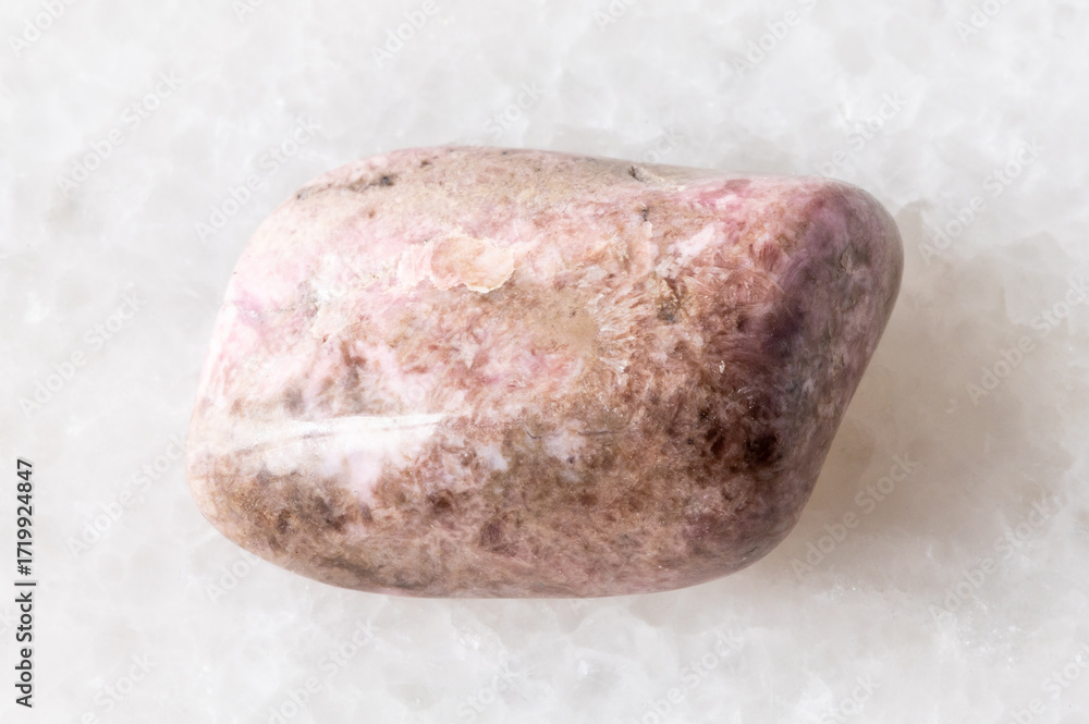 Obraz premium sample of tumbled pyroxmangite mineral on white