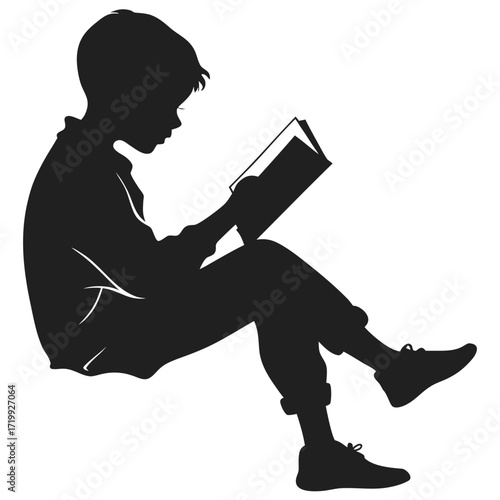 Boy reading storybook silhouette