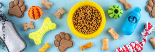Wallpaper Mural Flat lay composition with food, snacks, toys and accessories for dog and cat on bright background. Pet care, dog shopping and sale concept top view copy space Torontodigital.ca