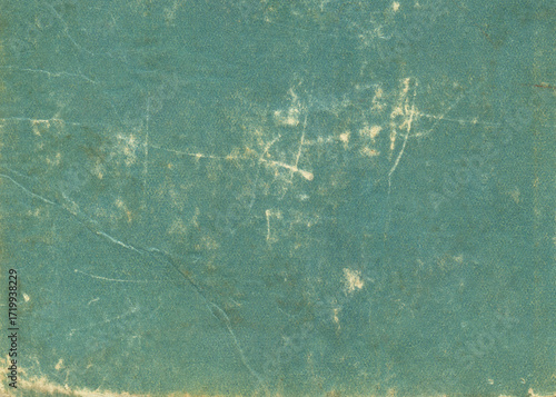 Green grunge scratched paper background. Texture of vintage book cover. 