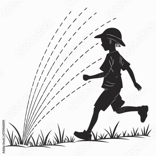 Child running through sprinklers silhouette