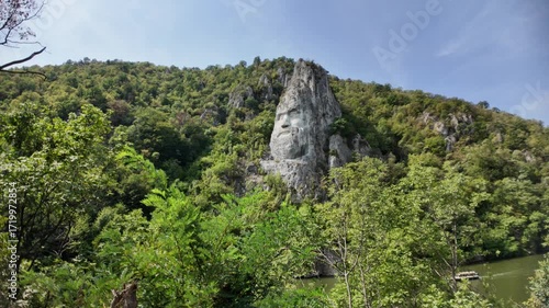 Decebalus Rex rock sculpture, a monumental carving of the Dacian king, standing proudly carved into the cliff face overlooking the Danube River at the Iron Gates gorge in Romania