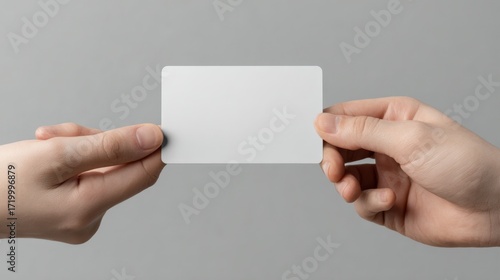 Two hands exchanging blank white business card