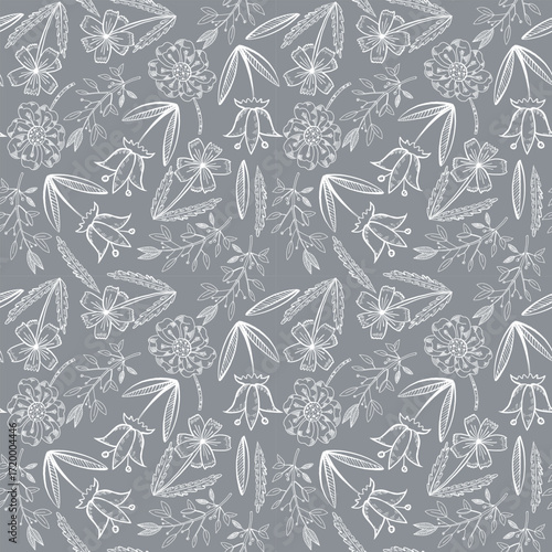 Vector seamless pattern of white meadow flowers on a gray background. Cornflowers, daisies, twigs, leaves, bell, all objects are hand-drawn with ink. Illustration for printing on fabric, paper.