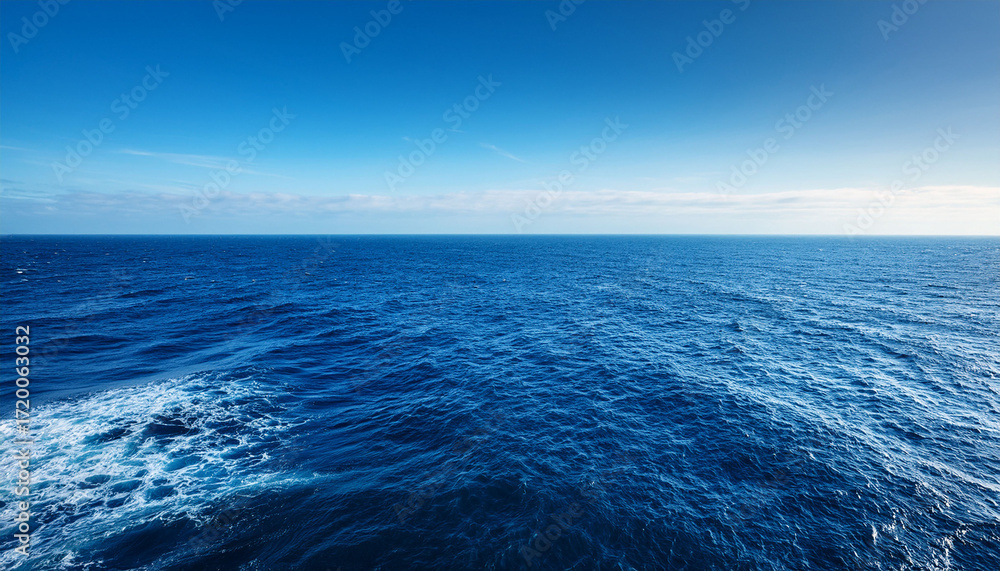 Fototapeta premium Vast Deep Blue Ocean Stretches To The Horizon Untouched And Serene Sunlight Glints On The Endless Waves A Mesmerizing Display Of Nature S Power And Beauty Vast Bright Day