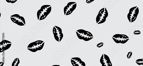 Seamless pattern displaying bold black lip shapes on a soft gray background, offering a modern and stylish design suitable for various creative applications