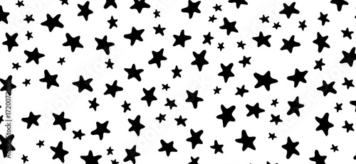 An artistic pattern features scattered black star shapes of varying sizes against a clean white backdrop, creating a celestial and playful aesthetic that is visually engaging