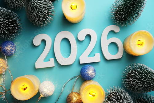 2026 Happy New Year with Christmas tree and Led candles decoration on blue background