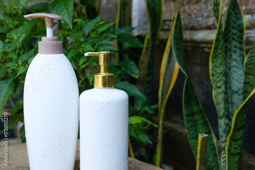 White Pump Bottles with Spa, Bathroom, and Plants.