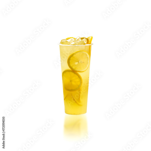 Cold lemon wheatgrass fruit tea in clear glass, isolated on white background