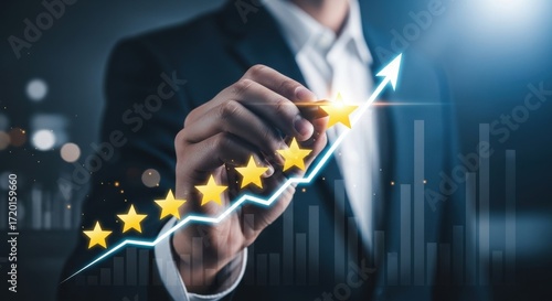 Fototapeta Naklejka Na Ścianę i Meble -  Businessman drawing a rising graph with five golden stars indicating excellent customer satisfaction and business growth