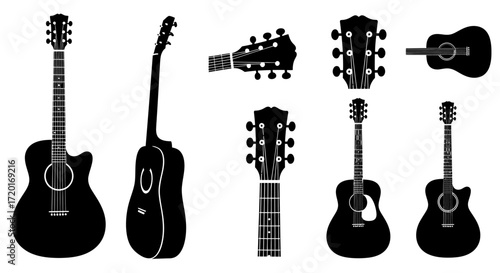 Silhouette of a black acoustic guitar against a light gray background.