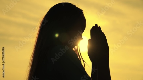 Obraz na plátně childhood dream of a happy childhood, silhouette of a teenager asking for help from God at sunset, praying for health at dawn, repenting of what he has done, faith in goodness and justice