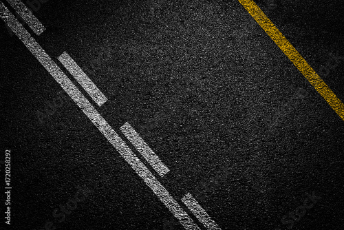 Fototapeta Naklejka Na Ścianę i Meble -  Surface grunge rough of asphalt, Seamless tarmac dark grey with yellow line on the road and small rock, Texture Background, Top view
