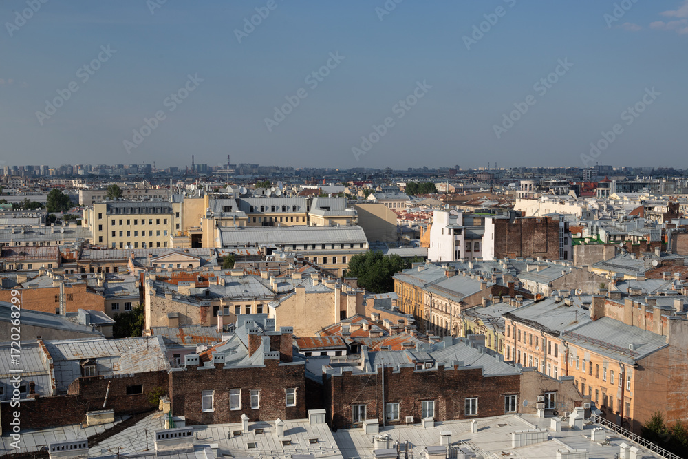 Obraz premium view on Saint Petersburg roofs of old historical houses, urban cityscape background with blue sky, Saint Petersburg, Russia, 25th of July, 2025