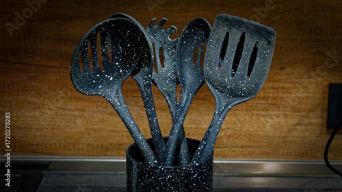 Used black with white dots plastic kitchen utensils
