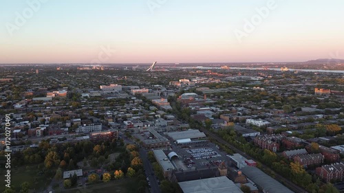 Wallpaper Mural Straight aerial shot over Montreal pointing directly to the Olympic Stadium. Autumn colors and sunset light highlight the cityscape. Torontodigital.ca