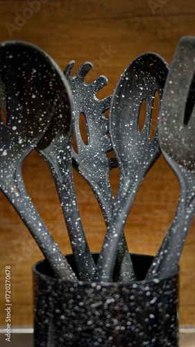 Used black with white dots plastic kitchen utensils