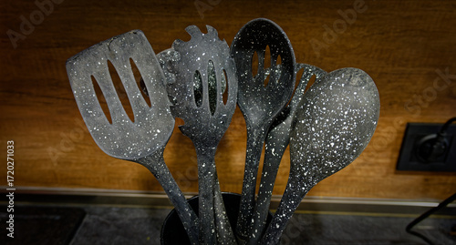 Used black with white dots plastic kitchen utensils