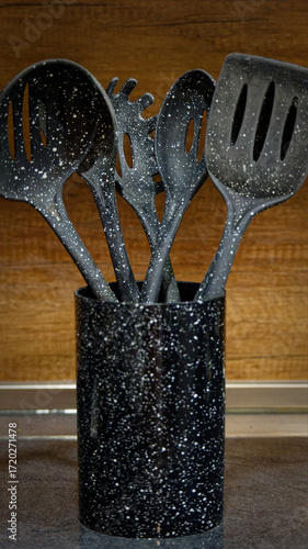 Used black with white dots plastic kitchen utensils