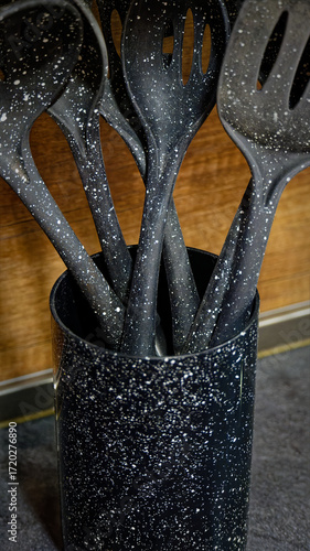 Used black with white dots plastic kitchen utensils