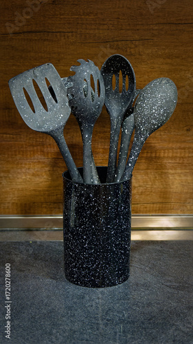 Used black with white dots plastic kitchen utensils
