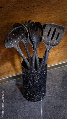 Used black with white dots plastic kitchen utensils