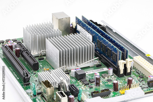 heat sink or computer processor cooler or radiator on computer motherboard.