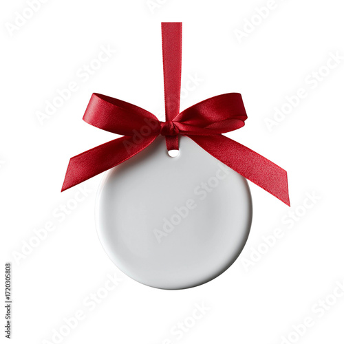 v a round, white ceramic ornament with a red ribbon bow hanging on the left side, isolated on a solid background, captured in high-resolution photography