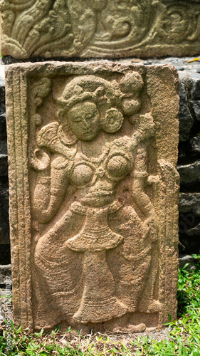 An ancient  sculpture of the Hindu god and goddess carved in stone
