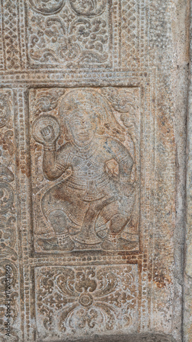 An ancient  sculpture of the Hindu god and goddess carved in stone