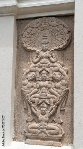 An ancient  sculpture of the Hindu god and goddess carved in stone
