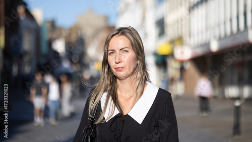 Slavic Woman in a School Dress on a City Street