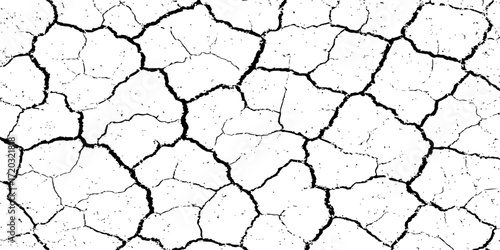 A drought-stricken landscape of dry, cracked earth reveals a textured pattern of clay soil