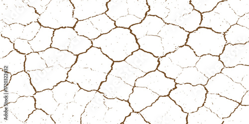 Brown dry cracked earth texture showing drought on the desert ground