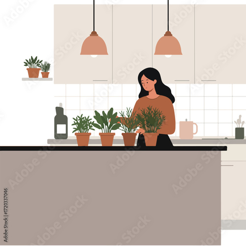 Woman in kitchen, tending potted plants on countertop under pendant lights