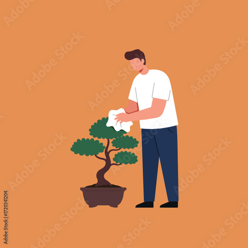 Man tending bonsai tree