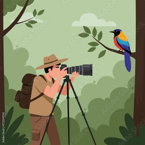 Bird photographer in a green forest with a colorful bird on a branch