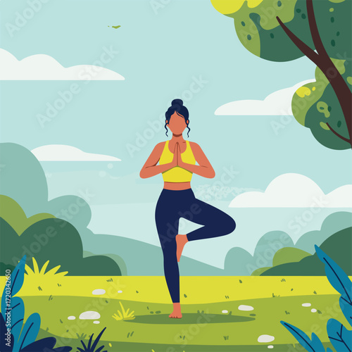 Woman does yoga pose in a park with a tree and blue sky background
