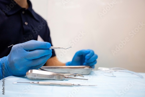 close-up of dentist hand with dental tools 