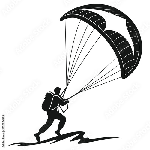 Kiteboarder launching from beach silhouette