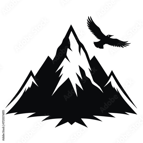 Majestic mountain peak silhouette with soaring eagle above